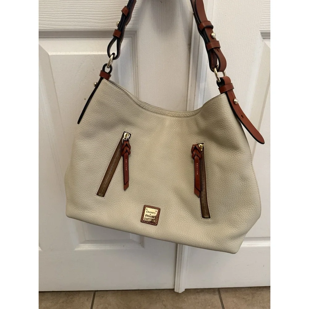 Dooney & Bourke Hobo Bag Women Large Cream Pebbled Leather Tan Trim Logo Plaque